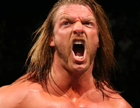 WWE Superstar Triple H screaming in middle of the ring